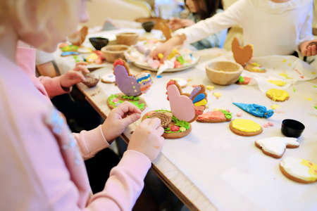 Children's hands make gingerbread. children cutting cookies. Kids baking cookies. Concept. Master...
