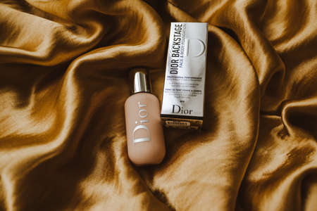 Tone cream with a box from Dior with logo. High quality photoのeditorial素材