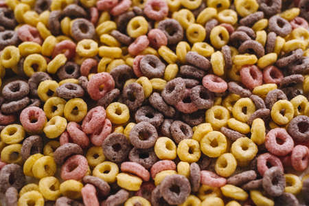 Multi-colored corn rings for breakfast, texture background. High quality photoの写真素材