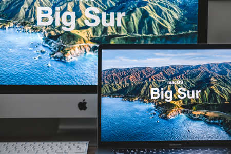MacBook with Mac OS Big Sur background logo on the screen, new operating system which will be released in the fall of 2020. High quality photoのeditorial素材