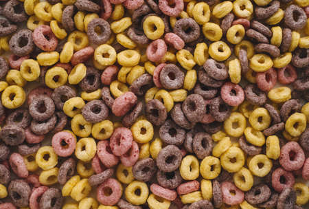 Multi-colored corn rings for breakfast, texture background. High quality photoの写真素材