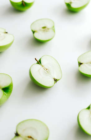 Sliced green apple isolated on a white background. Selective focus. High quality photo