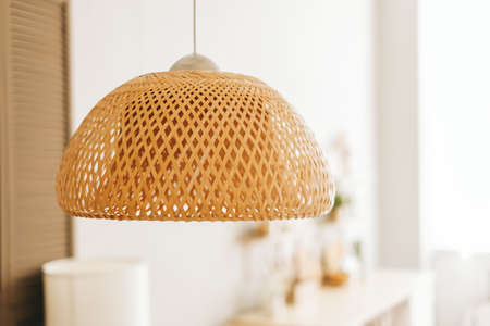 Straw lampshade in modern living room. Eco-friendly interior design using natural materials.