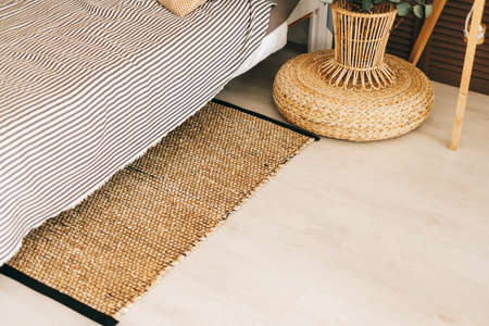 Eco-friendly bedside mat in modern bedroom interior. High quality photoの写真素材