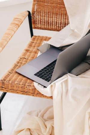 Laptop computer on stylish chair in living room. Nobody.の写真素材