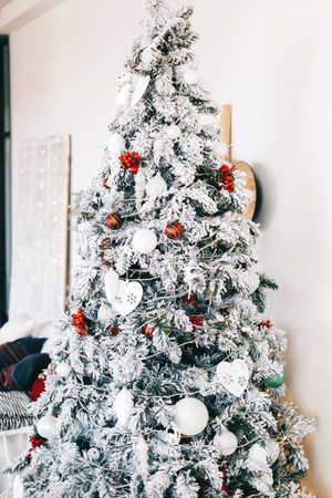 Beautiful Christmas tree in bright white living room.の写真素材