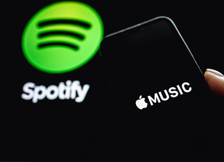 Screen shot of Apple music app and Spotify. Apple Music and Spotify the most popular music streaming...