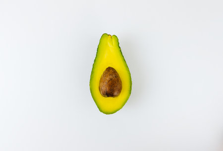 Ripe avocado sliced isolated on a white background, copy space.