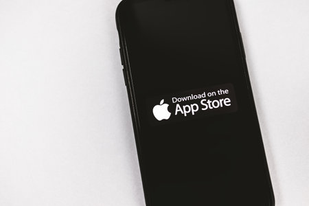 Smartphone with download on the app store icon. High quality photo.のeditorial素材
