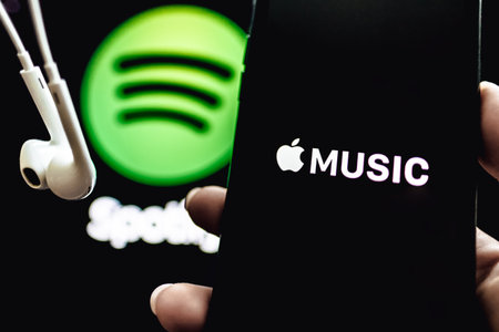 Screen shot of Apple music app and Spotify. Apple Music and Spotify the most popular music streaming...
