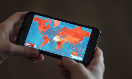 mobile game, simulator of the coronovirus pandemic on a world map. High quality photo.のeditorial素材