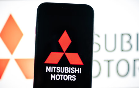 Mitsubishi motors logo on iPhone, mitsubishi motors is a Japanese company that makes cars.のeditorial素材