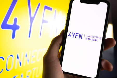 4YFN logo on smartphone screen. High quality photo.