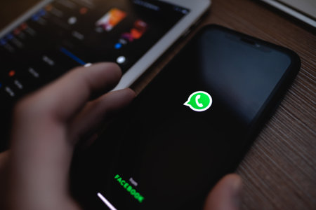 WhatsApp dark mode on the smartphone screen. High quality photoのeditorial素材