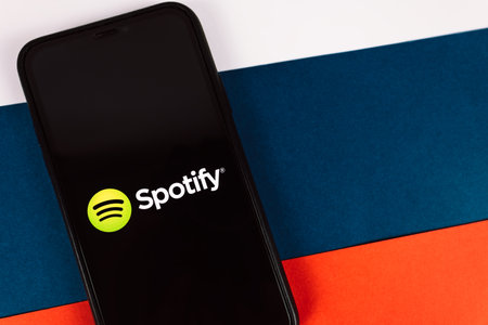 iPhone with screen shot of Spotify app. High quality photo.のeditorial素材