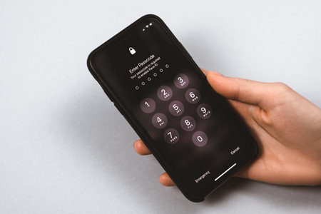 iPhone lock screen on iOS in hand. Password menu. High quality photo