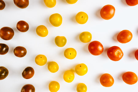 Varieties of cherry tomatoes in line isolated on white background, abstraction.の写真素材