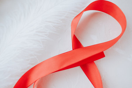 Festive red ribbon on a white background in the form of a figure eight. Women's day concept.の写真素材