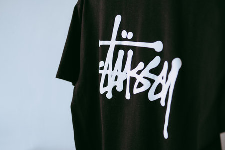 Stussy logo on T shirt. Stussy is a hype street wear brand.