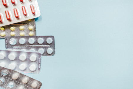 Tablets in packs. Tablets on a light background. Different types of pills.の写真素材
