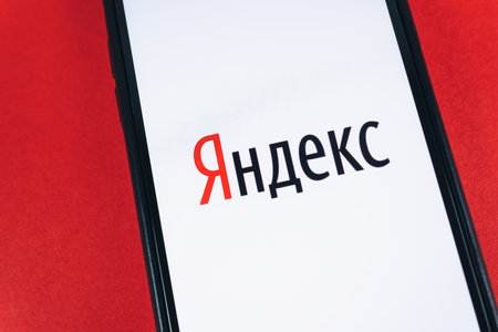 Smartphone with Yandex logo on the screen. High quality photo.