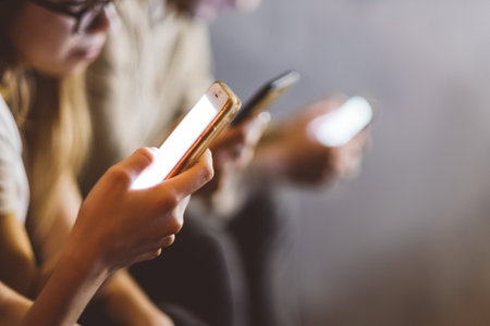 Group of people uses a smartphone close-up. High quality photoの写真素材