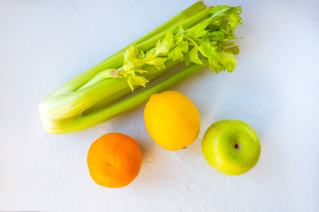 Bright fresh fruits and vegetables on a white background.の写真素材