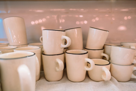 handmade tea and coffee cups in white with a black rim. cafe and coffee shop concept. High quality photoの写真素材