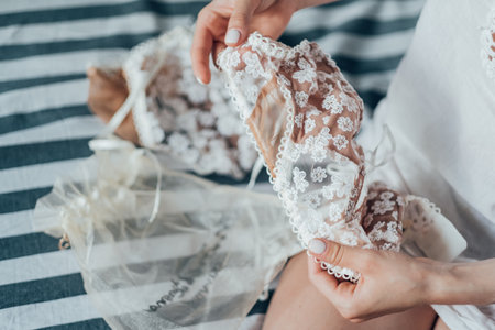 Girl holding a gift bag with women's underwear, pastel romantic colorsの写真素材