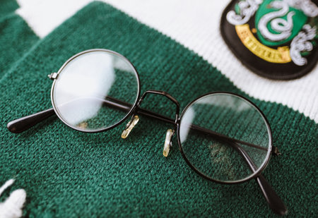 Harry Potter glasses on slytherin faculty scarf. High quality photoのeditorial素材
