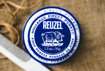 REUZEL hair styling man, fiber pomade. High quality photo.