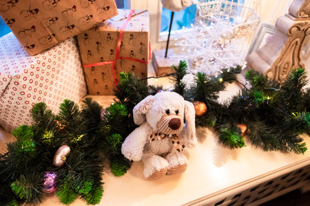 Christmas and New Year gifts and toys on the window. Home decoration for the holiday. High quality photoの写真素材