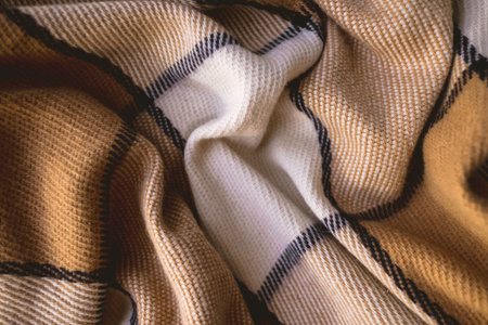 Background texture of warm checkered woolen plaid. Clous up.