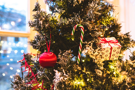 Beautiful Christmas tree decorated with toys on the window at home. High quality photoの写真素材