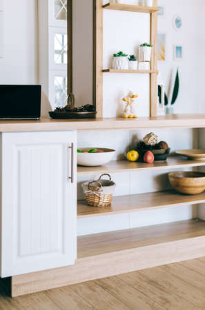 Interior of modern kitchen in a Scandinavian style with wooden shelves and wooden dishesの写真素材