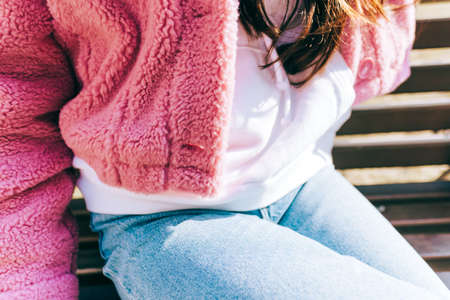 Young stylish woman in pink jacket, close-up shot. Youth cultureの写真素材