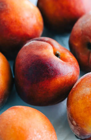 Fresh ripe peaches on the table, close-up