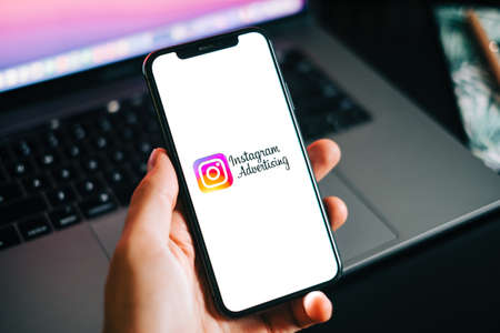 Instagram ads logo on the smartphone screen.のeditorial素材