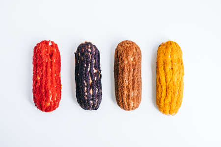 Multicolored eclairs isolated on white background.の写真素材