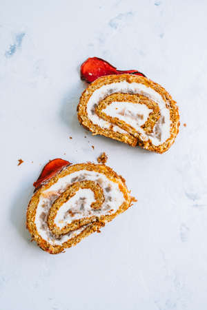 Roll dessert with mascarpone cheese and nuts in a biscuit.の写真素材