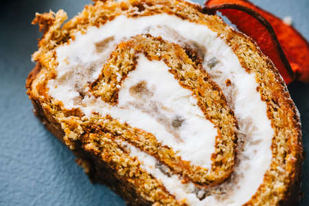 Roll dessert with mascarpone cheese and nuts in a biscuit.の写真素材