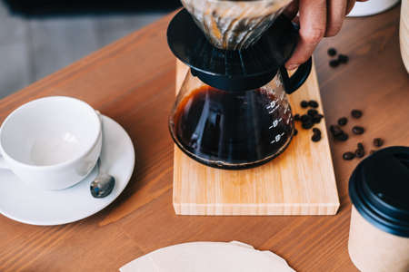 Alternative coffee brewing method, using pour over dripper and paper filter.の写真素材