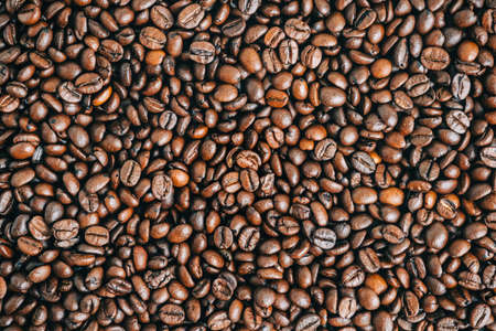 Roasted coffee beans background, top view.の写真素材