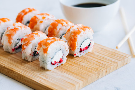 Tasty shrimp rolls on bamboo board with soy sauce, close up. Japanese foodの写真素材