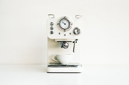 Home mini coffee machine on a white table.の写真素材