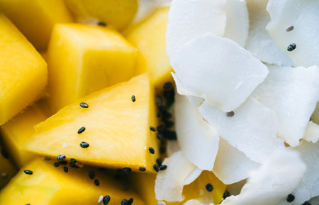 Mango and coconut chips with chia seeds, close up.