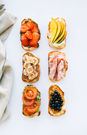 Delicious healthy toasts mix for breakfast, lunch or snack on white background.の写真素材