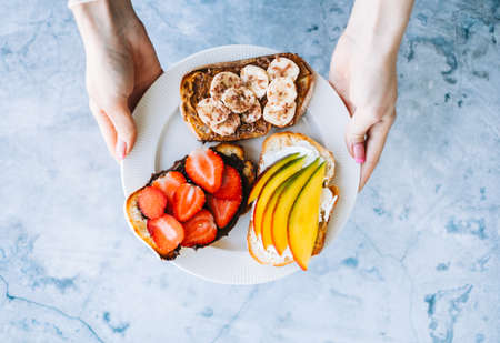 Delicious fruit toasts mix for breakfast, lunch or snack. Healthy foodの写真素材