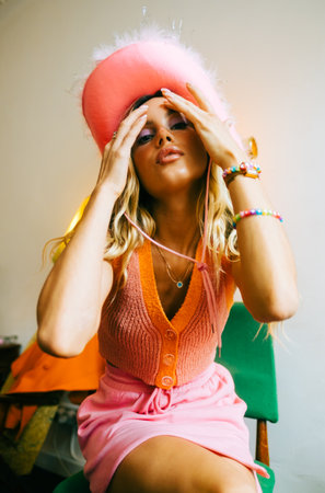 Portrait of attractive caucasian woman fashion model with blonde hair in pink cowboys hat , posingの写真素材
