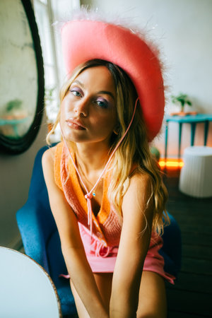 Portrait of attractive caucasian woman fashion model with blonde hair in pink cowboys hat , posingの写真素材